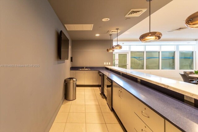 1250 S Miami Ave Unit 2208, Miami, FL 33130 - bar with a sink, hanging light fixtures, light tile patterned floors, baseboards, and recessed lighting
