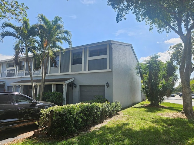 4131 NW 79th Ave Unit 4131, Sunrise, FL 33351 - view of home's exterior featuring a garage and stucco siding