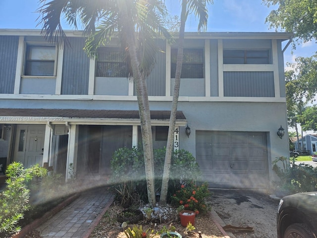 4131 NW 79th Ave Unit 4131, Sunrise, FL 33351 - view of front of home featuring an attached garage and stucco siding