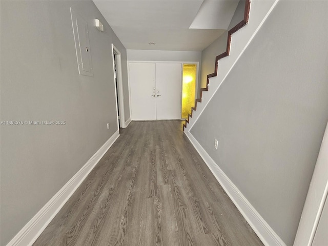 4131 NW 79th Ave Unit 4131, Sunrise, FL 33351 - hall featuring wood finished floors, stairway, baseboards, and electric panel
