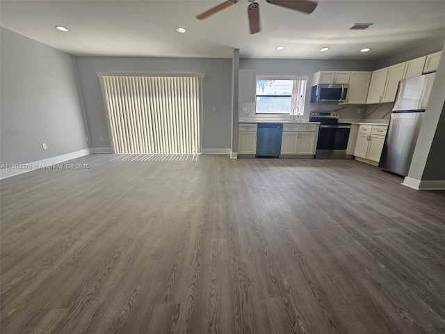 4131 NW 79th Ave Unit 4131, Sunrise, FL 33351 - unfurnished living room with ceiling fan, dark wood-type flooring, recessed lighting, baseboards, and a sink