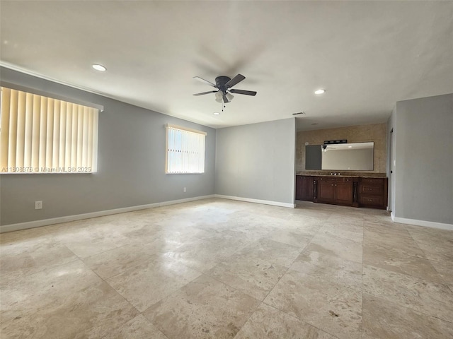 4131 NW 79th Ave Unit 4131, Sunrise, FL 33351 - unfurnished living room featuring a ceiling fan, baseboards, and recessed lighting