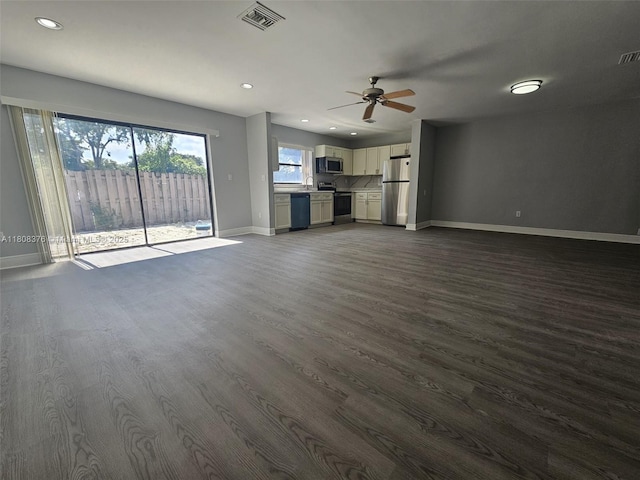 4131 NW 79th Ave Unit 4131, Sunrise, FL 33351 - unfurnished living room with baseboards, ceiling fan, dark wood-style floors, recessed lighting, and a sink