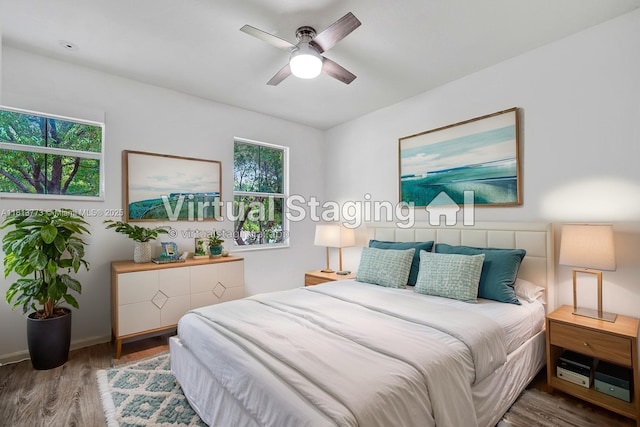 4284 Cascada Cir, Cooper City, FL 33024 - bedroom featuring wood finished floors, multiple windows, ceiling fan, and baseboards