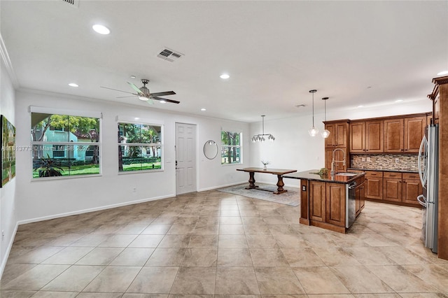 4284 Cascada Cir, Cooper City, FL 33024 - kitchen featuring freestanding refrigerator, a sink, brown cabinets, light tile patterned floors, and recessed lighting