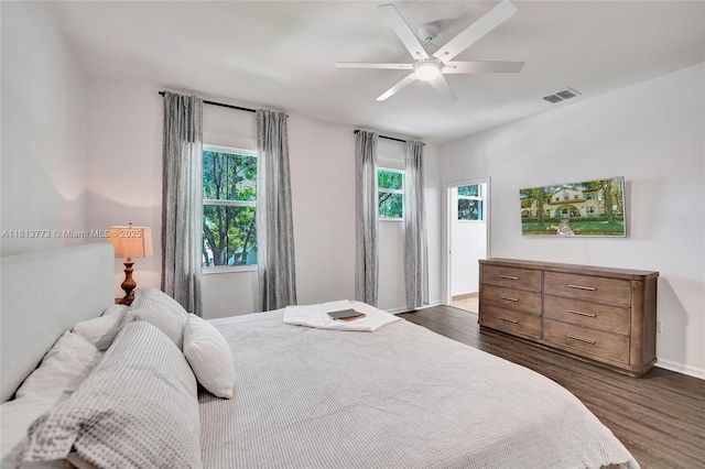 4284 Cascada Cir, Cooper City, FL 33024 - bedroom with dark wood-style flooring, baseboards, and ceiling fan