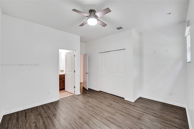 4284 Cascada Cir, Cooper City, FL 33024 - unfurnished bedroom featuring wood finished floors, baseboards, a closet, and connected bathroom