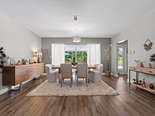 9200 SW 178th Ter, Palmetto Bay, FL 33157 - dining area featuring healthy amount of natural light, dark wood-style floors, and baseboards