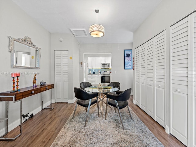 9200 SW 178th Ter, Palmetto Bay, FL 33157 - dining area featuring wood finished floors and baseboards