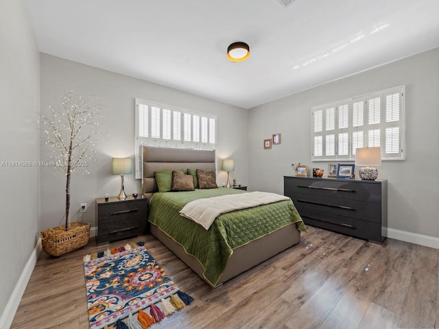 9200 SW 178th Ter, Palmetto Bay, FL 33157 - bedroom featuring wood finished floors and baseboards