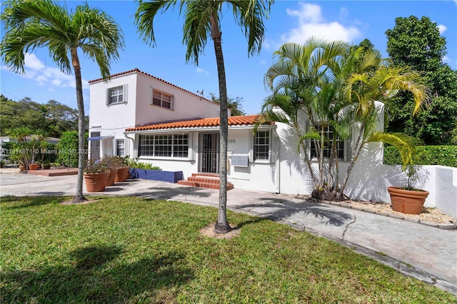 1105 NE 119th St, Biscayne Park, FL 33161 - view of front of home featuring a tile roof and stucco siding