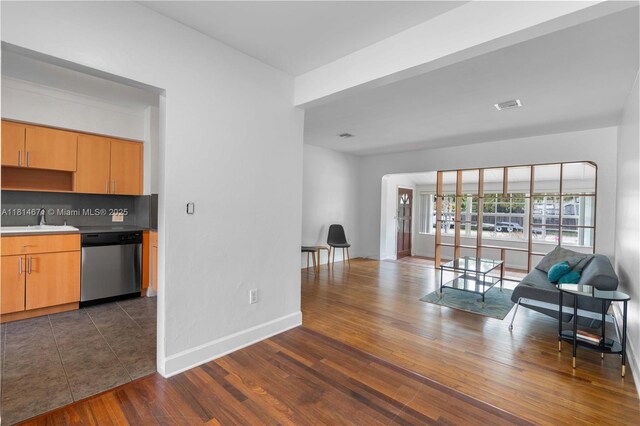 1105 NE 119th St, Biscayne Park, FL 33161 - living area with baseboards and dark wood finished floors