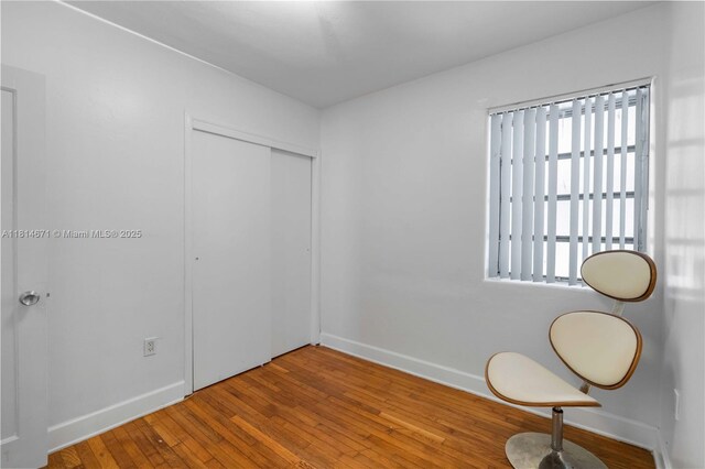 1105 NE 119th St, Biscayne Park, FL 33161 - unfurnished bedroom with hardwood / wood-style floors and a closet