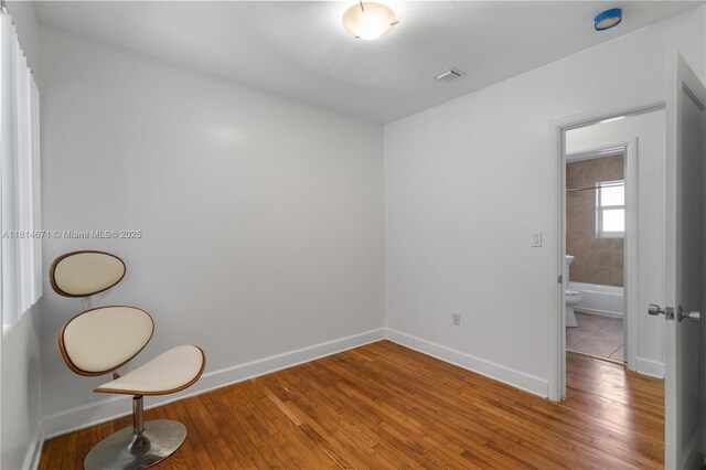 1105 NE 119th St, Biscayne Park, FL 33161 - unfurnished room with baseboards and light wood-type flooring