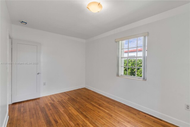 1105 NE 119th St, Biscayne Park, FL 33161 - empty room with baseboards and light wood finished floors