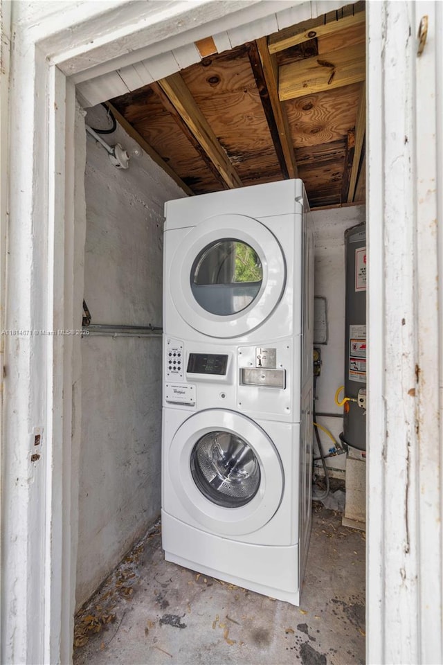 1105 NE 119th St, Biscayne Park, FL 33161 - laundry room featuring stacked washer / drying machine and water heater
