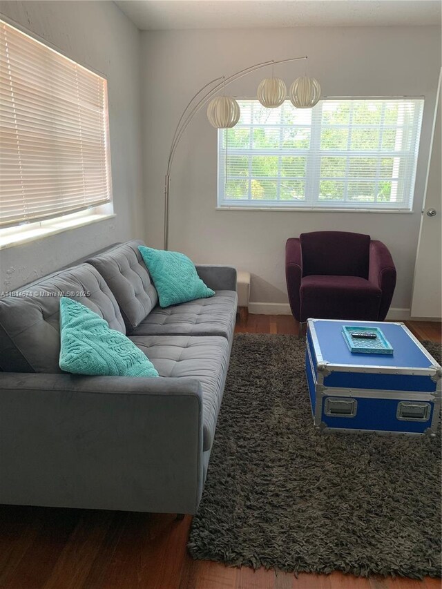 1105 NE 119th St, Biscayne Park, FL 33161 - living room with wood finished floors and healthy amount of natural light
