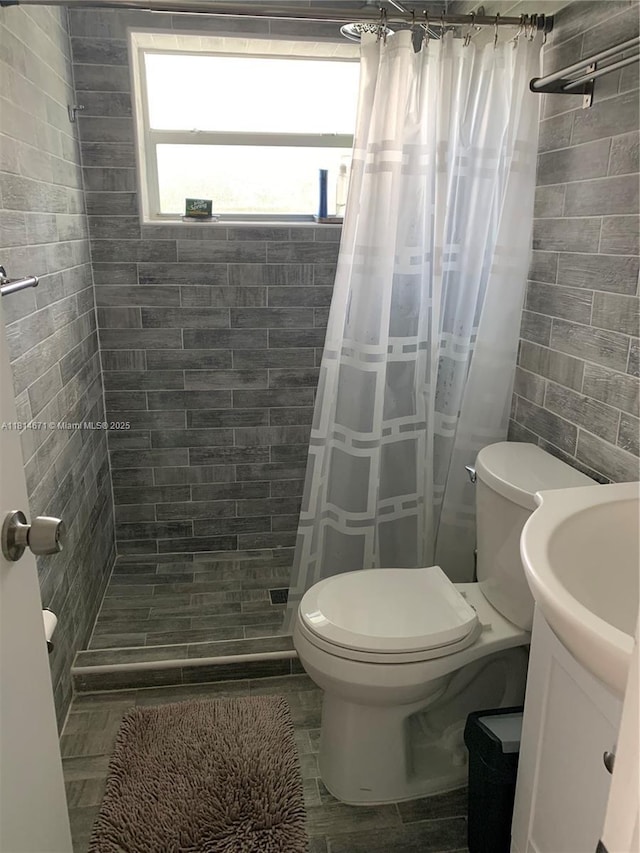 1105 NE 119th St, Biscayne Park, FL 33161 - bathroom featuring vanity, tiled shower, and tile walls