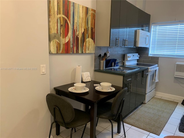 1105 NE 119th St, Biscayne Park, FL 33161 - kitchen featuring white appliances, dark countertops, decorative backsplash, and light tile patterned flooring
