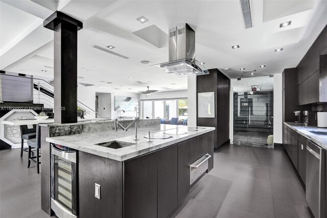2612 Key Largo Ln, Fort Lauderdale, FL 33312 - kitchen with beverage cooler, modern cabinets, island range hood, and dark cabinetry