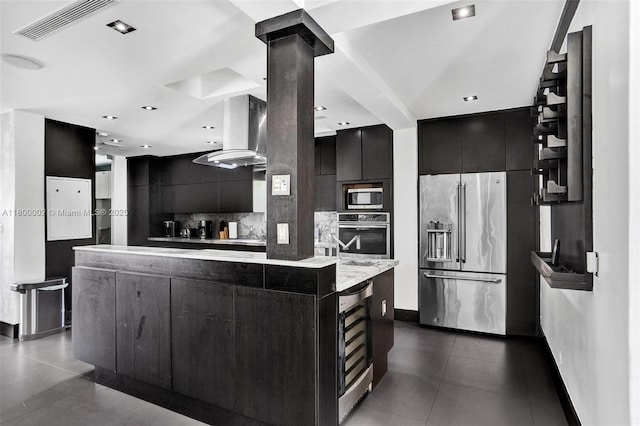 2612 Key Largo Ln, Fort Lauderdale, FL 33312 - kitchen featuring stainless steel appliances, dark cabinetry, modern cabinets, beverage cooler, and tasteful backsplash