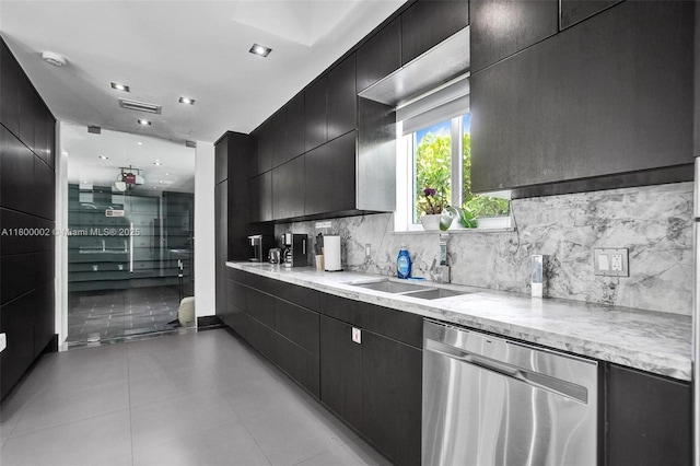 2612 Key Largo Ln, Fort Lauderdale, FL 33312 - kitchen featuring dishwasher, dark cabinetry, decorative backsplash, and modern cabinets