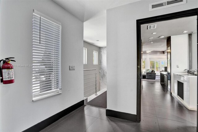 2612 Key Largo Ln, Fort Lauderdale, FL 33312 - hall with baseboards and tile patterned flooring