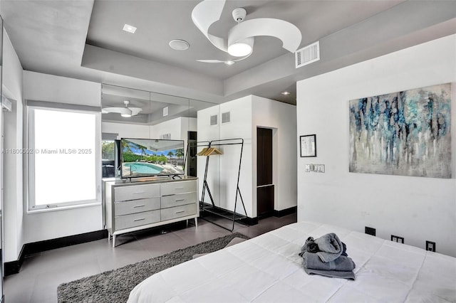2612 Key Largo Ln, Fort Lauderdale, FL 33312 - bedroom featuring a tray ceiling and dark tile patterned floors