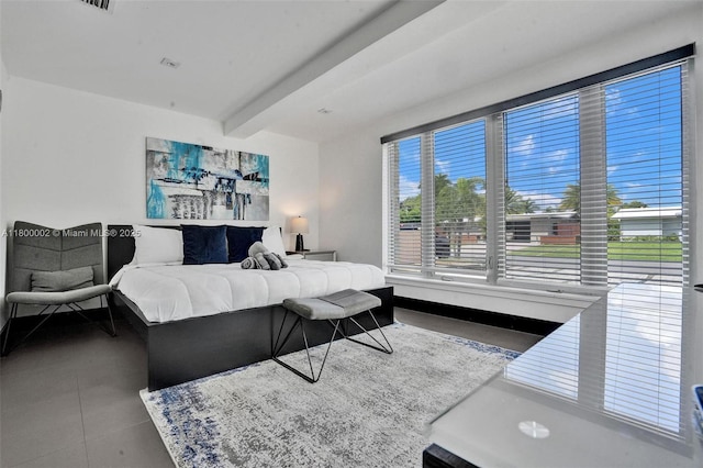 2612 Key Largo Ln, Fort Lauderdale, FL 33312 - tiled bedroom featuring beam ceiling and baseboards