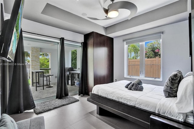 2612 Key Largo Ln, Fort Lauderdale, FL 33312 - bedroom with access to outside, a raised ceiling, a ceiling fan, and light tile patterned flooring