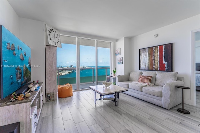 50 Biscayne Blvd Unit 3106, Miami, FL 33132 - living area with a wall of windows, light wood-style flooring, and a water view