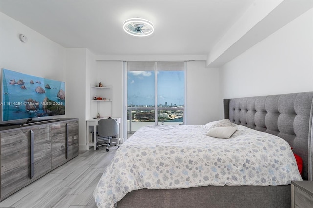 50 Biscayne Blvd Unit 3106, Miami, FL 33132 - bedroom with wood finished floors, a desk, and access to outside