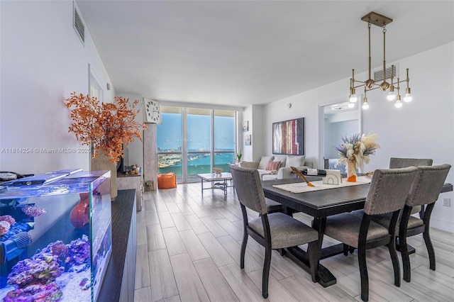 50 Biscayne Blvd Unit 3106, Miami, FL 33132 - dining area featuring a wall of windows and light wood-type flooring