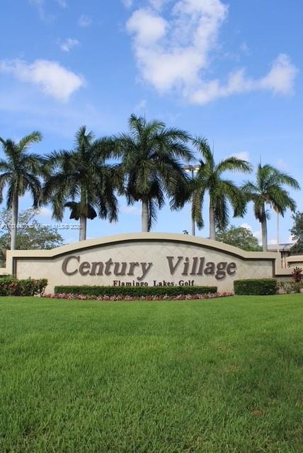 251 SW 132nd Way Unit 306H, Pembroke Pines, FL 33027 - community sign with a yard