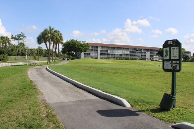 251 SW 132nd Way Unit 306H, Pembroke Pines, FL 33027 - surrounding community with a yard