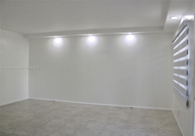 251 SW 132nd Way Unit 306H, Pembroke Pines, FL 33027 - spare room featuring baseboards and recessed lighting