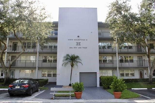 251 SW 132nd Way Unit 306H, Pembroke Pines, FL 33027 - view of apartment building / complex featuring uncovered parking