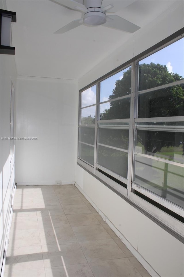 251 SW 132nd Way Unit 306H, Pembroke Pines, FL 33027 - empty room with a ceiling fan, healthy amount of natural light, and light tile patterned floors