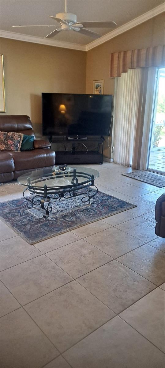 520 NW 166th Ave, Pembroke Pines, FL 33028 - living area featuring ornamental molding and a ceiling fan