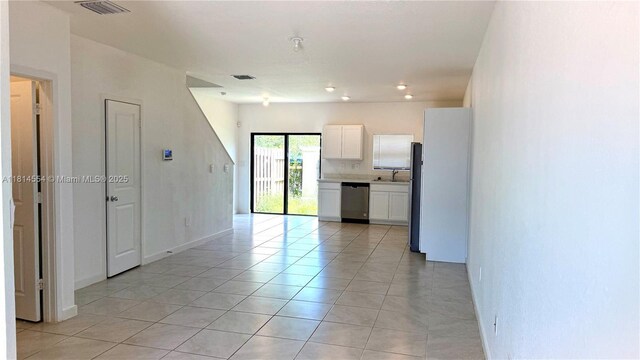 322 NE 1st Dr, Florida City, FL 33034 - unfurnished room featuring light tile patterned floors, a pendent fire sprinkler, and recessed lighting