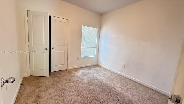 322 NE 1st Dr, Florida City, FL 33034 - unfurnished bedroom featuring carpet and a closet