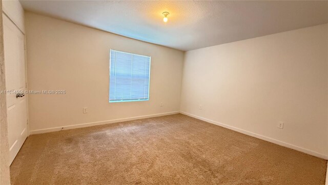 322 NE 1st Dr, Florida City, FL 33034 - empty room with carpet and baseboards