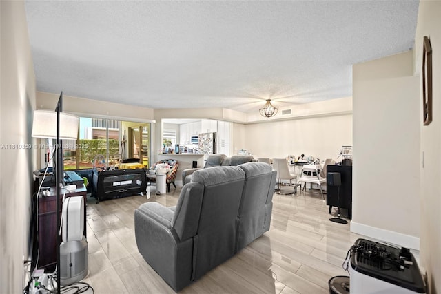2649 SE 19th Ct Unit 106-D, Homestead, FL 33035 - living room with a textured ceiling