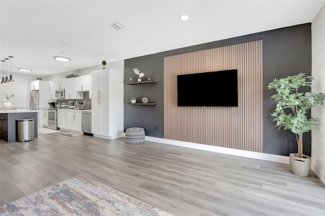 24686 SW 119th Pl, Homestead, FL 33032 - unfurnished living room featuring light wood finished floors, baseboards, and recessed lighting