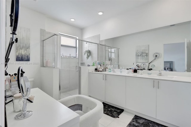 24686 SW 119th Pl, Homestead, FL 33032 - full bathroom with double vanity, a freestanding bath, a shower stall, tile patterned flooring, and recessed lighting