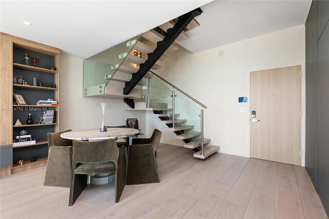 90 SW 3rd St Ph-14, Miami, FL 33130 - dining area featuring stairs and light wood-style floors