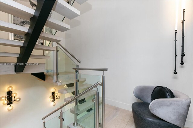 90 SW 3rd St Ph-14, Miami, FL 33130 - staircase with wood finished floors and baseboards