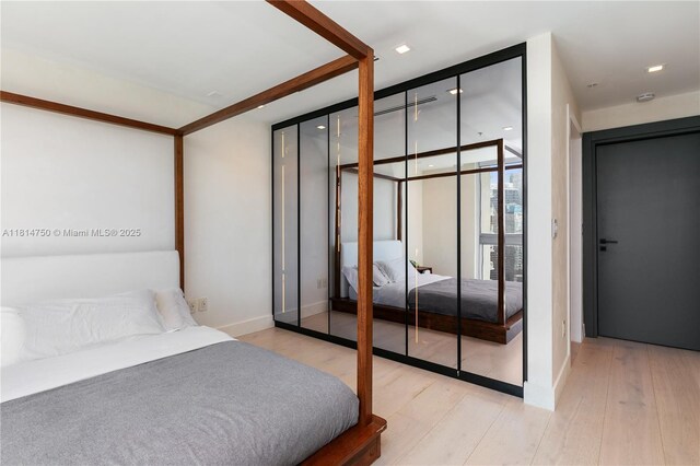 90 SW 3rd St Ph-14, Miami, FL 33130 - bedroom featuring wood finished floors and baseboards