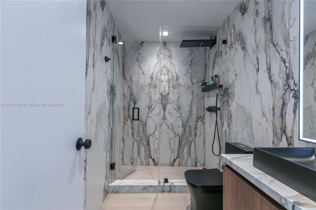 90 SW 3rd St Ph-14, Miami, FL 33130 - bathroom with a marble finish shower, toilet, vanity, and tile walls