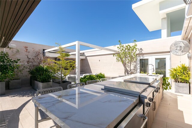 90 SW 3rd St Ph-14, Miami, FL 33130 - view of patio featuring french doors, a sink, and outdoor dining space